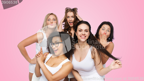 Image of group of happy women in white underwear having fun