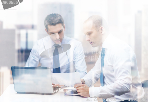 Image of two businessmen having discussion in office