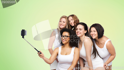 Image of group of happy women taking selfie by smartphoone