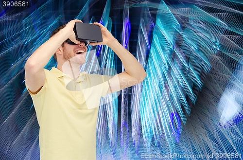 Image of happy man in virtual reality headset or 3d glasses