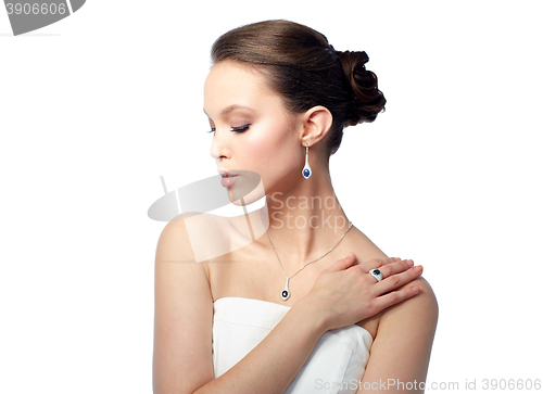 Image of beautiful woman with earring, ring and pendant