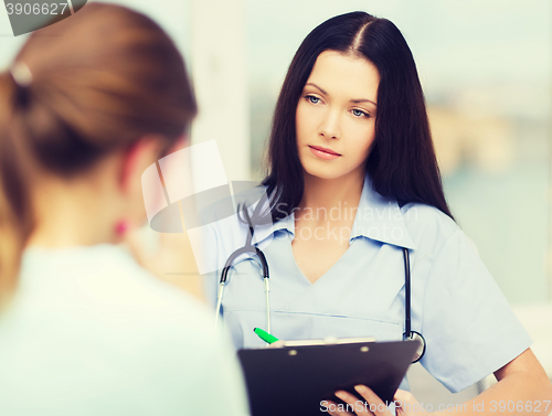 Image of female doctor or nurse with patient