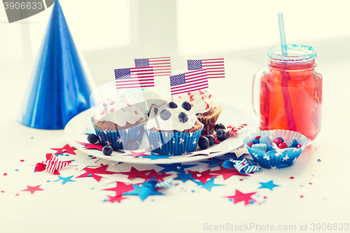 Image of cupcakes with american flags on independence day