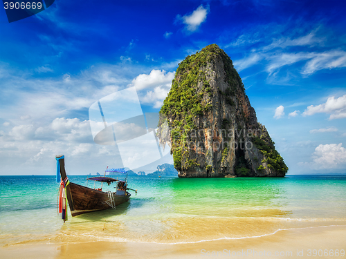 Image of Long tail boat on beach, Thailand