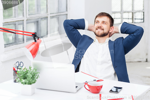 Image of The male office worker resting