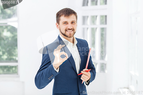 Image of The smiling male office worker