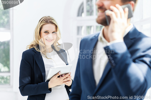 Image of Male and female office workers.