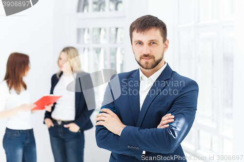 Image of Male and female office workers.