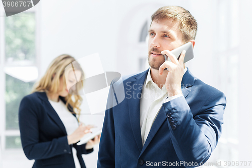 Image of Male and female office workers.