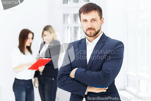 Image of Male and female office workers.