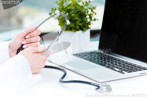 Image of Doctor with a stethoscope in the hands