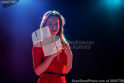 Image of The beautiful girl dancing at the party drinking champagne
