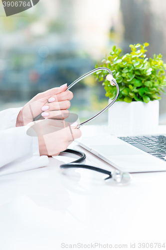 Image of Doctor with a stethoscope in the hands