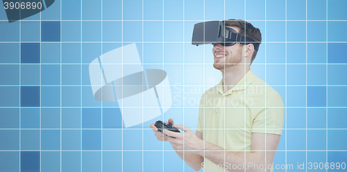 Image of happy man in virtual reality headset with gamepad