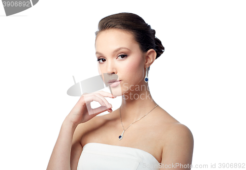 Image of beautiful asian woman with earring and pendant