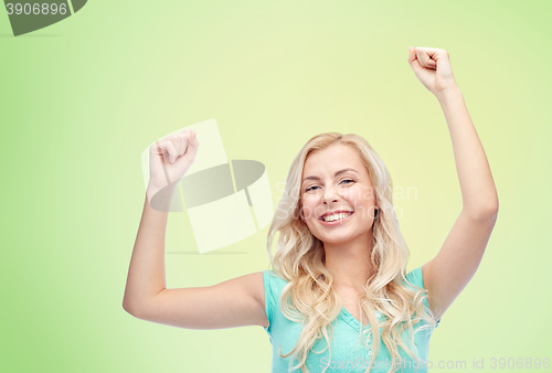 Image of happy young woman or teen girl celebrating victory
