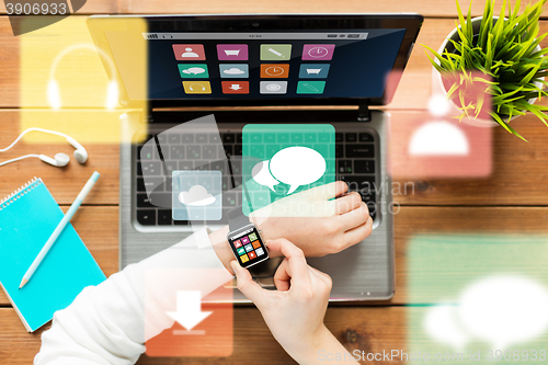 Image of close up of woman with smart watch and laptop