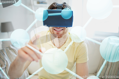 Image of young man in virtual reality headset or 3d glasses