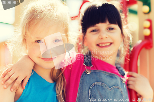 Image of group of happy little girls on children playground