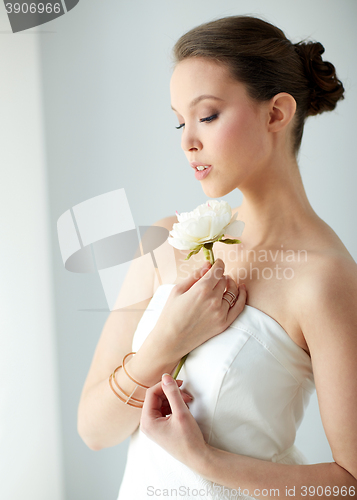 Image of beautiful asian woman with flower and jewelry