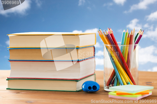 Image of close up of crayons or color pencils and books