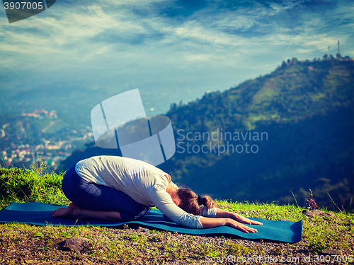 Image of Sporty fit woman practices yoga asana Balasana