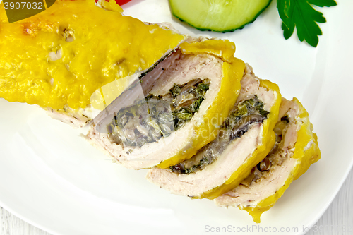 Image of Roll chicken with mushrooms and cucumber on board top