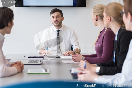 Image of young business people group on team meeting at modern office