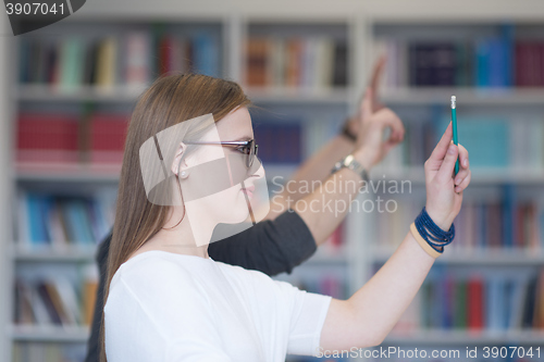 Image of group of students  raise hands up