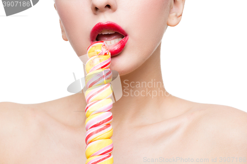 Image of Close-up shot of woman\'s mouth bright red lips with lollipop. blowjob simulation