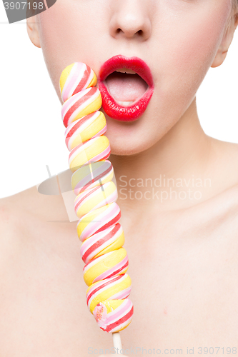 Image of Close-up shot of woman\'s mouth bright red lips with lollipop. blowjob simulation