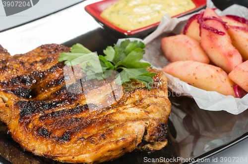 Image of plate of grilled meat with fries