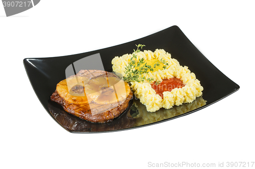 Image of Pork tenderloin with grilled pineapple. Macro. Isolated white background