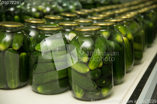 Image of gurtsov conservation. Fresh cucumbers in jars