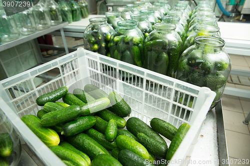 Image of gurtsov conservation. Fresh cucumbers in jars