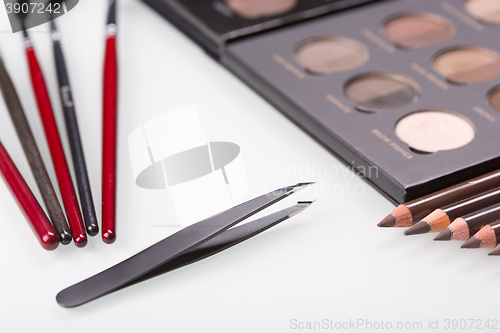 Image of shadows eye and eyebrow set on table