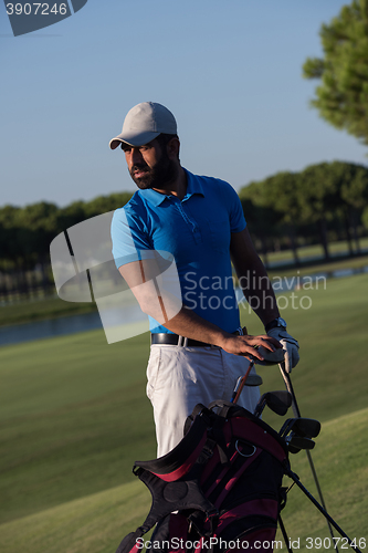 Image of golfer  portrait at golf course