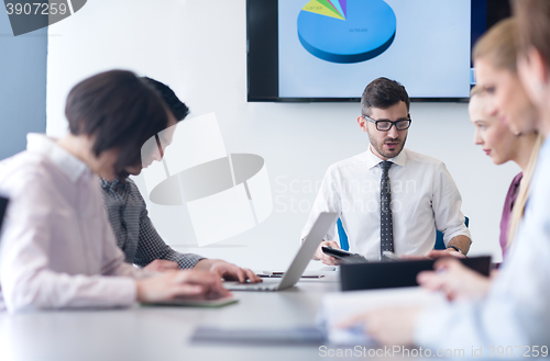 Image of young business people group on team meeting at modern office