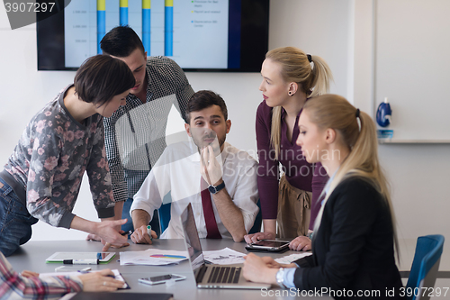 Image of young business people group on meeting at modern office