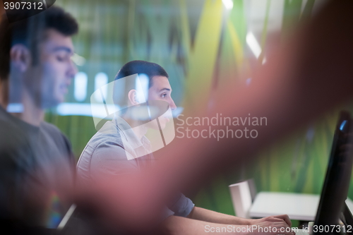 Image of technology students group working  in computer lab school  class