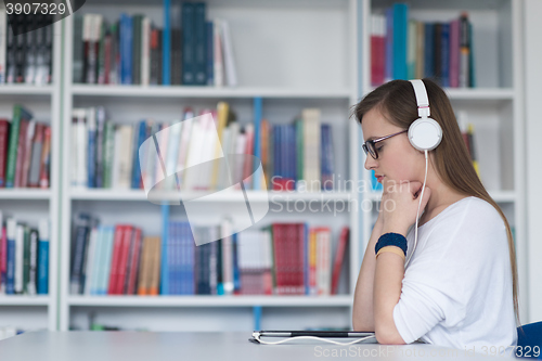 Image of female student study in library