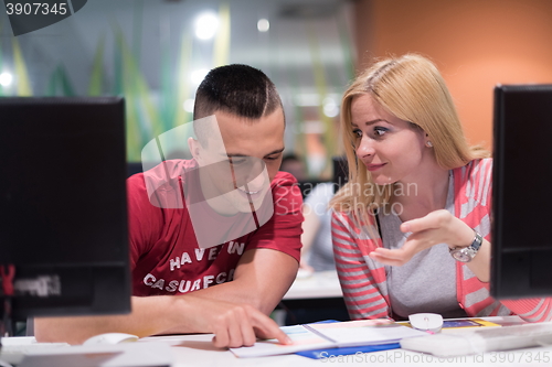 Image of technology students group working  in computer lab school  class