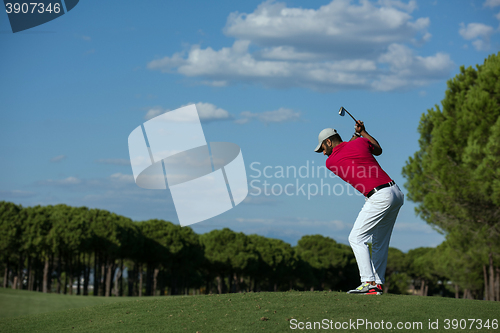 Image of golf player hitting long shot