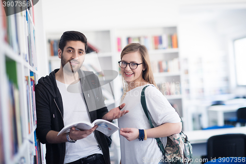 Image of students couple  in school  library