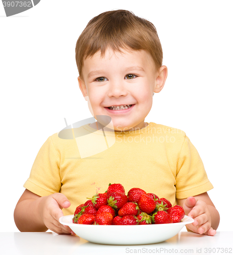 Image of Little boy with strawberries