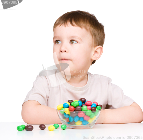 Image of Portrait of a boy with candies