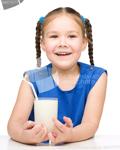 Image of Cute little girl with a glass of milk