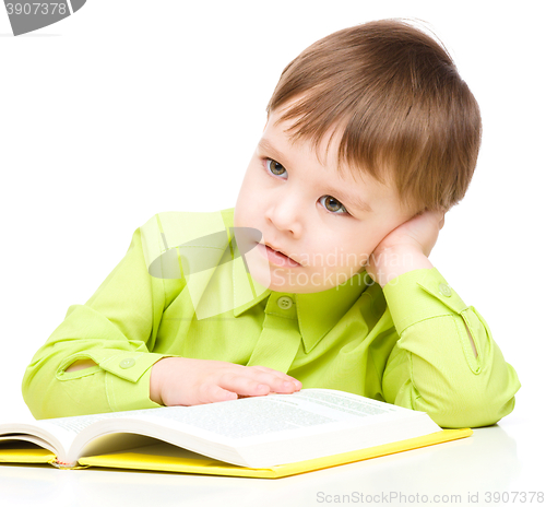 Image of Little child play with book