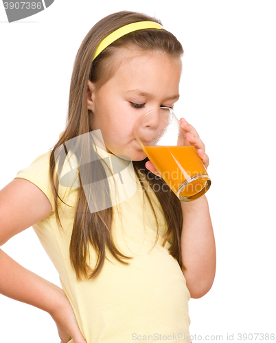 Image of Little girl is drinking orange juice