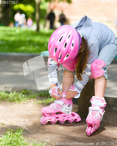 Image of Little girl is wearing roller-blades